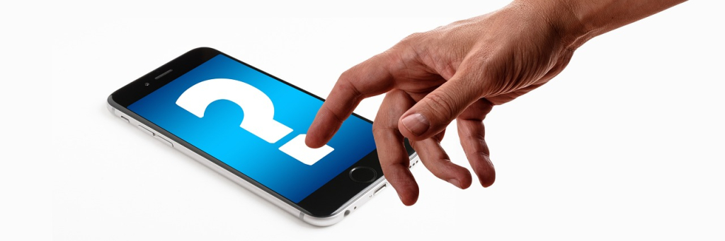 Interrogante y teléfono móvil